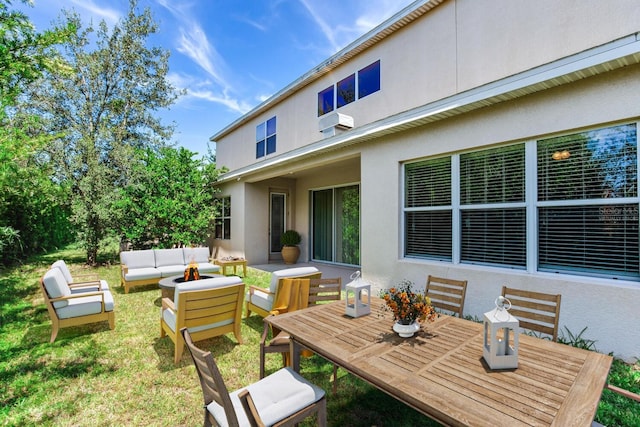 exterior space with a yard and outdoor lounge area