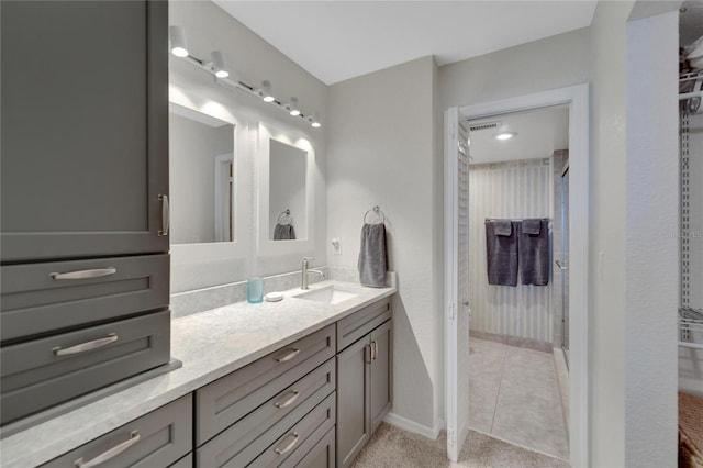 bathroom with tile flooring and vanity