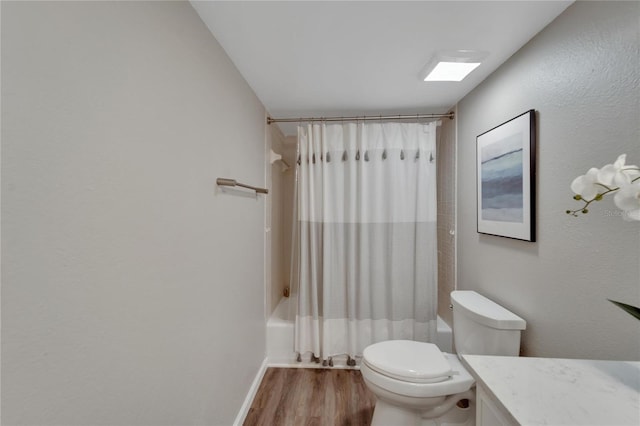 full bathroom with shower / bathtub combination with curtain, toilet, vanity, and hardwood / wood-style floors