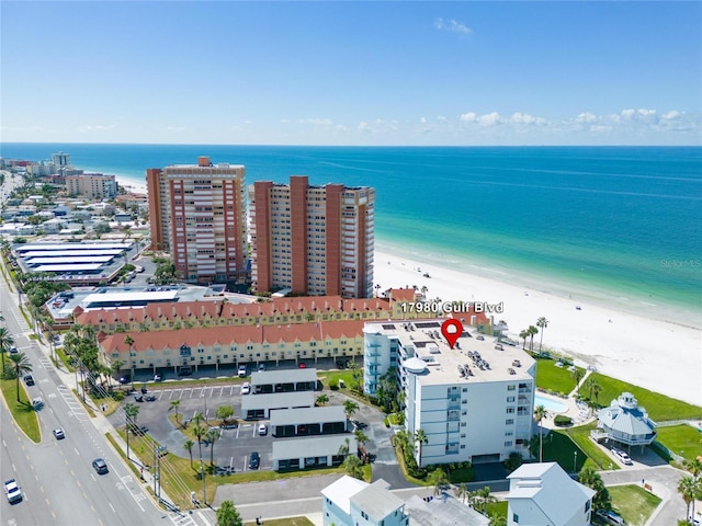 birds eye view of property featuring a water view and a view of the beach