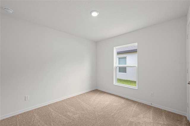 empty room featuring carpet flooring