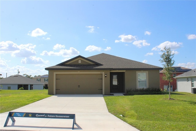 single story home with a front lawn and a garage