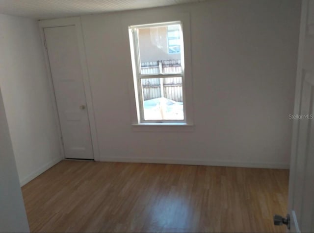 spare room featuring light wood-type flooring