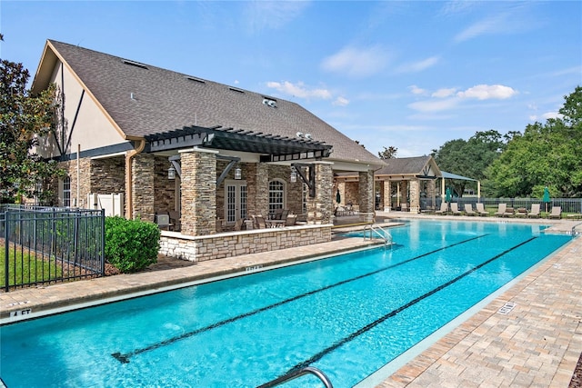 view of swimming pool with a pergola and a patio area