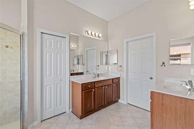 bathroom with vanity, tile patterned floors, and walk in shower