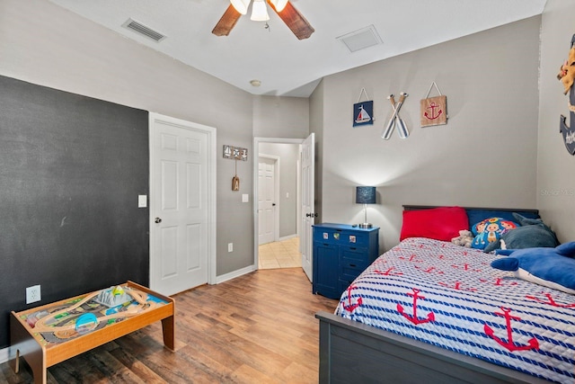 bedroom with light hardwood / wood-style flooring and ceiling fan