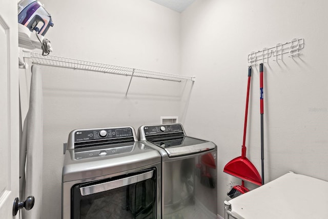 laundry area with washer and clothes dryer