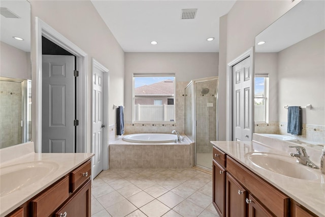 bathroom featuring tile patterned flooring, vanity, and independent shower and bath