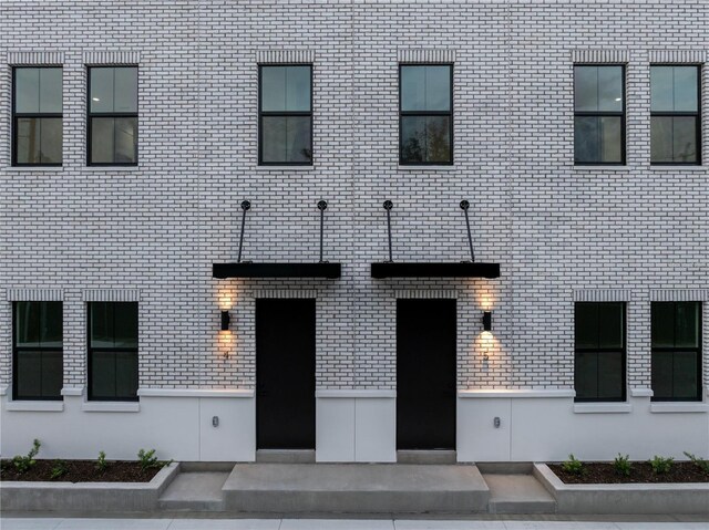 entrance to property with brick siding