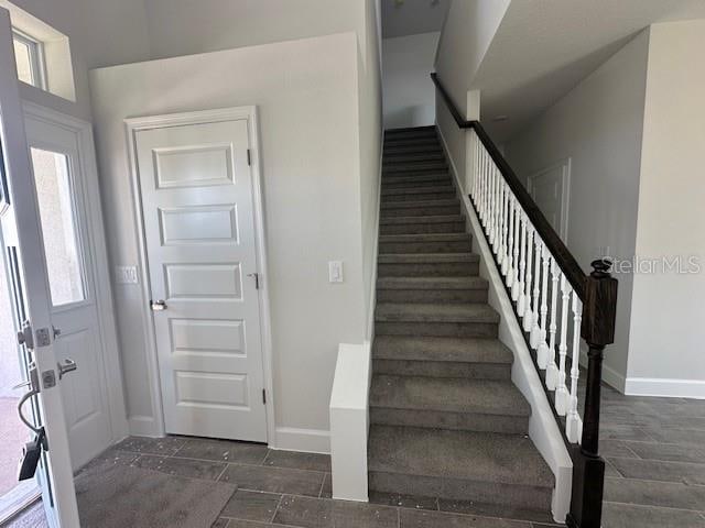 7002 162nd Pl E, Parrish, FL 34219 - staircase with baseboards and wood finish floors