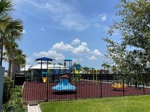 7002 162nd Pl E, Parrish, FL 34219 - community jungle gym with a yard and fence