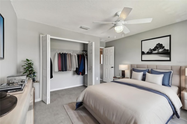 carpeted bedroom featuring a closet and ceiling fan