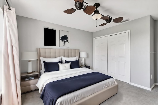 bedroom featuring a closet, ceiling fan, and carpet