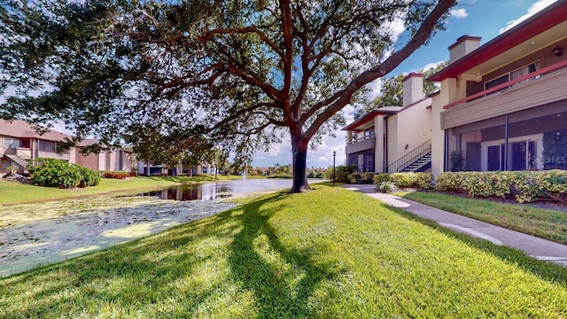 view of property's community with a yard