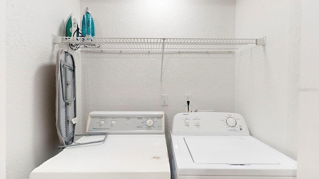 laundry room featuring washer and clothes dryer