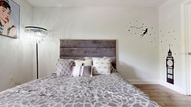 unfurnished bedroom featuring dark wood-type flooring and a textured ceiling