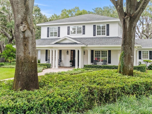 view of property featuring a porch