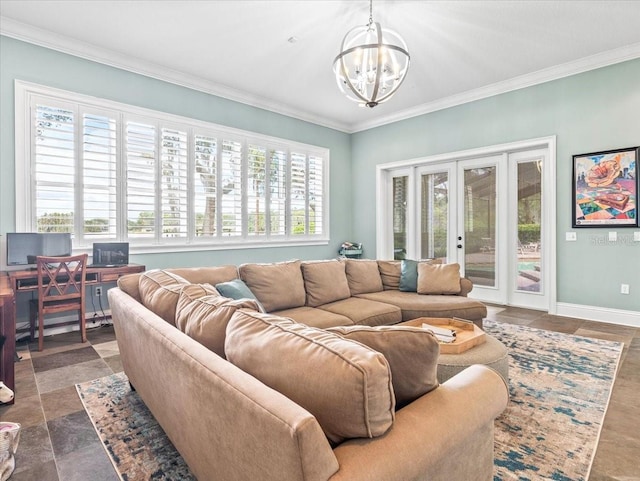 living room featuring dark tile floors, ornamental molding, french doors, and an inviting chandelier