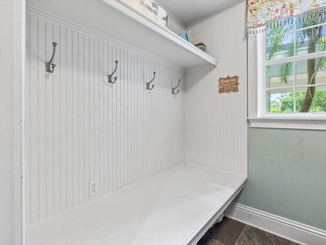 mudroom featuring dark tile flooring