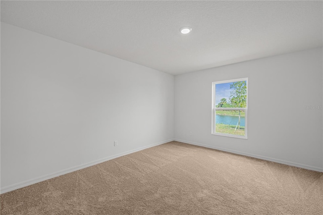 spare room with carpet flooring