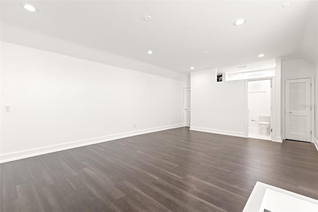 unfurnished living room with dark hardwood / wood-style floors