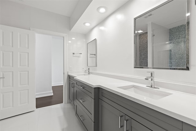 bathroom featuring vanity, tile patterned floors, and a shower with door