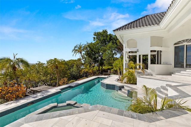 view of pool with outdoor lounge area and a patio area