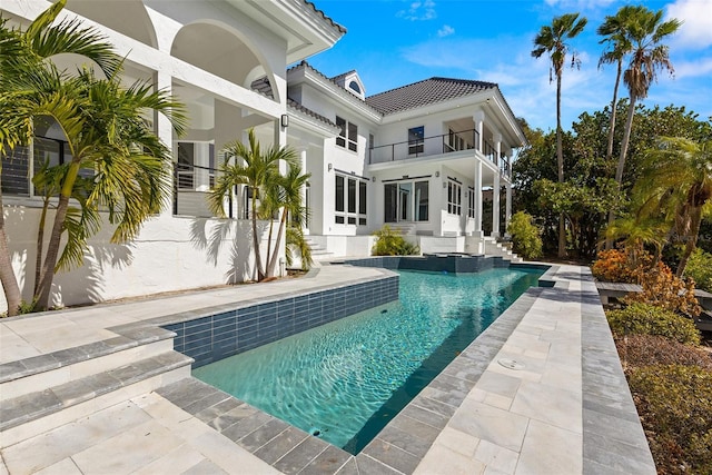 view of swimming pool featuring a patio area