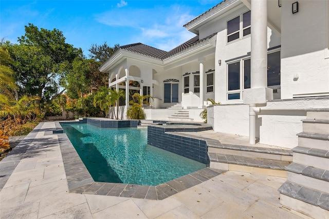 view of pool featuring a patio area