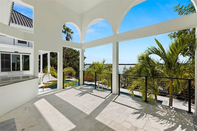 view of patio featuring a balcony