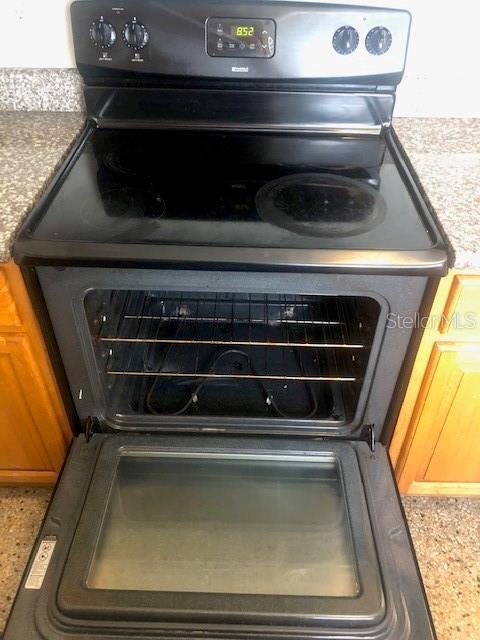 details featuring range with electric stovetop