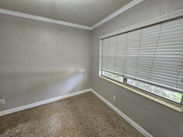 empty room with crown molding and a textured ceiling