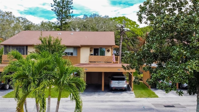 view of front of home with a carport