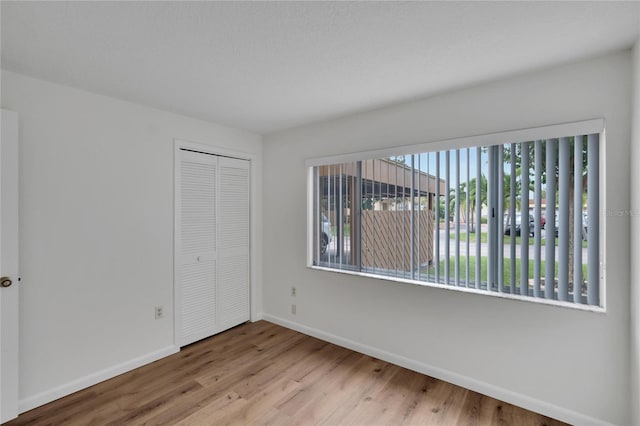 empty room with light wood-type flooring