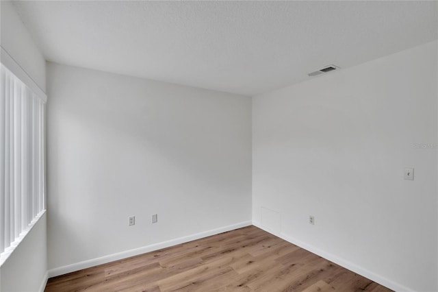 spare room with light wood-type flooring