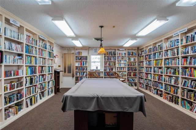 playroom featuring a textured ceiling, billiards, and dark carpet