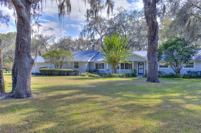 ranch-style house with a front lawn