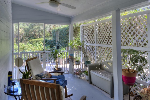 sunroom / solarium with ceiling fan and lofted ceiling