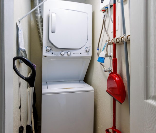 laundry room with stacked washer and dryer