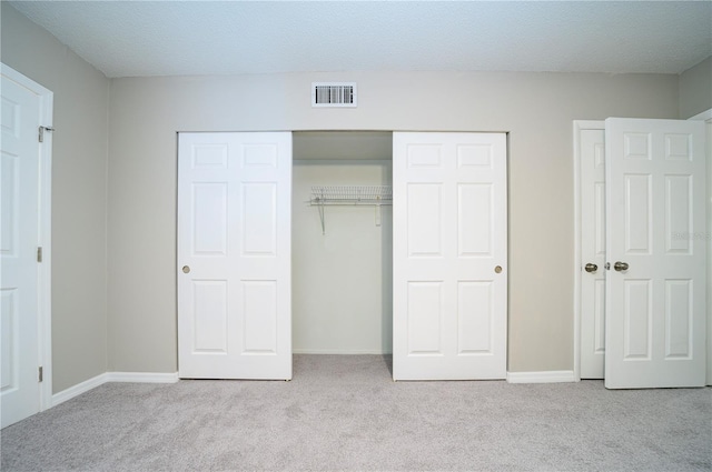 unfurnished bedroom with light carpet