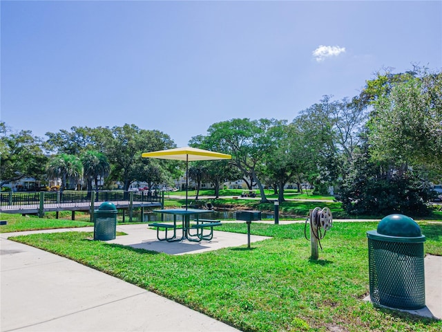 view of property's community with a lawn