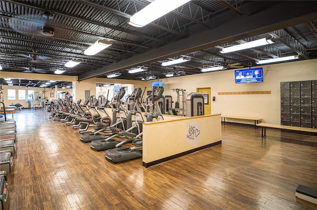 gym featuring dark wood-type flooring