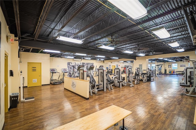 workout area with dark hardwood / wood-style floors