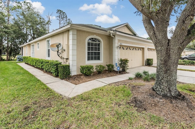 view of property exterior with a garage and a yard