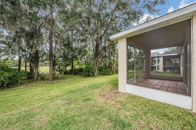 view of yard featuring a sunroom