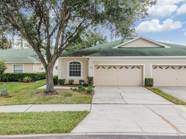 ranch-style house with a front lawn and a garage