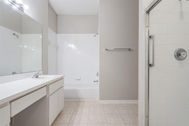 bathroom with vanity, tile patterned floors, and tiled shower / bath