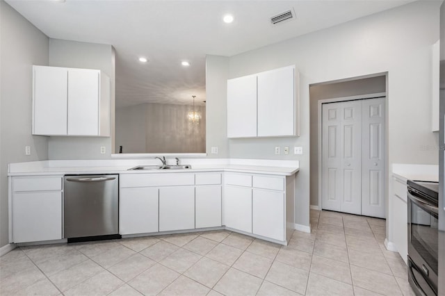 kitchen featuring white cabinetry, sink, stainless steel dishwasher, black electric range, and pendant lighting