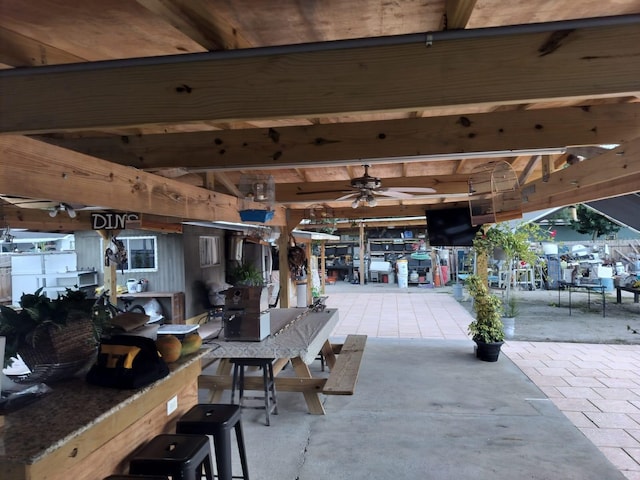 view of patio / terrace featuring a gazebo and ceiling fan