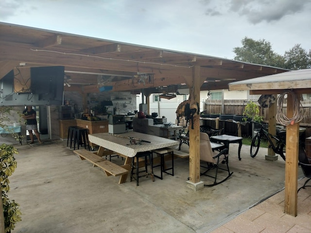 view of patio with an outdoor bar